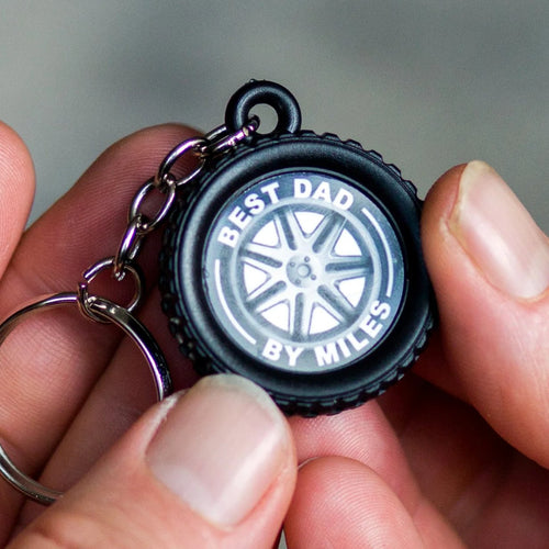 keyring in the shape of a car tyre with the words 'Best Dad By Miles'