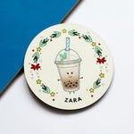 coasters for the christmas table with each persons name and illustration