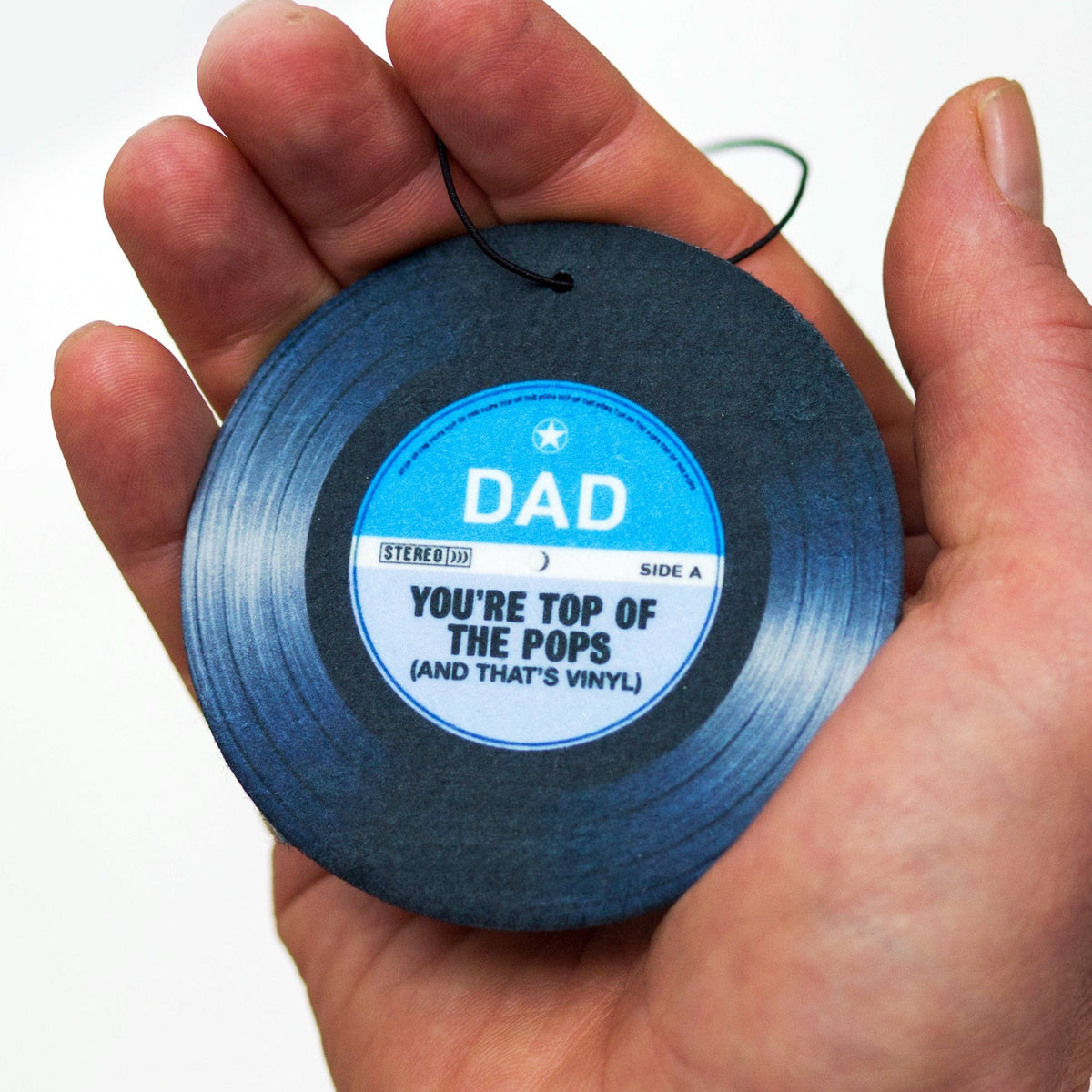 an air freshener for a car rearview mirror designed to look like a vinyl record that has a label dedicated to Dad
