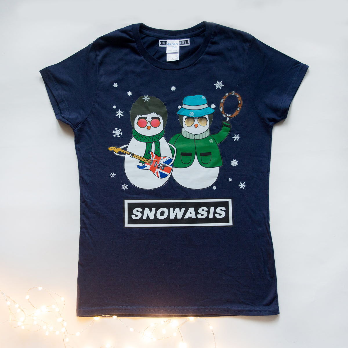 Navy blue t-shirt with snowman graphic and 'SNOWASIS' text on a light background