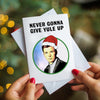 christmas card with illustration of Rick Astley and funny pun