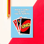 A card saying dad is number one using Uno cards