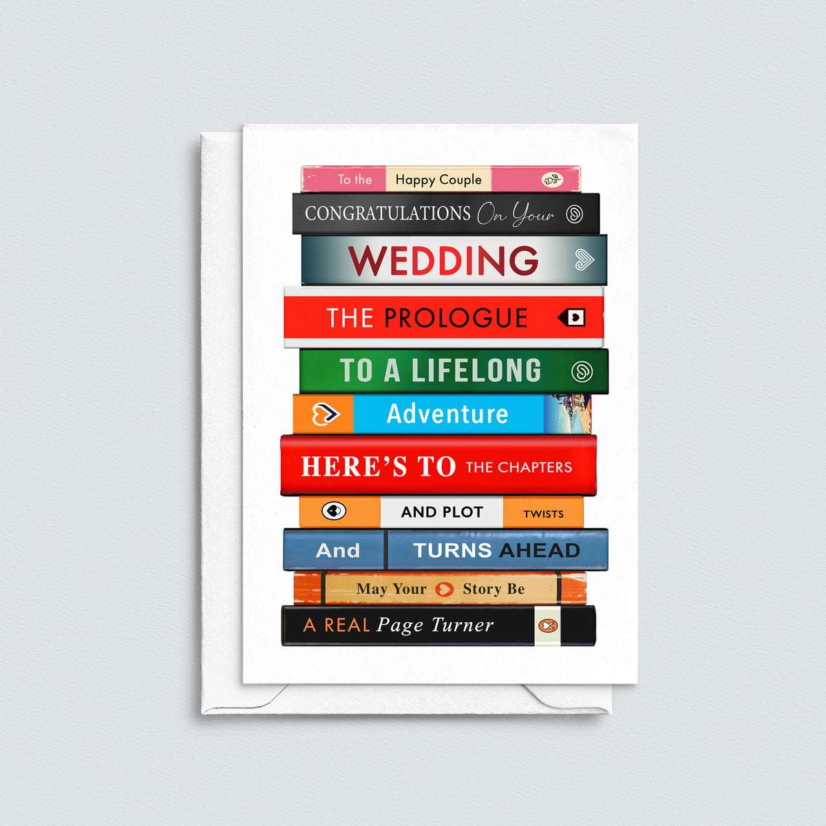 a greeting card featuring a stack of books with a congratulations on your wedding message spelt out with book titles on a grey background