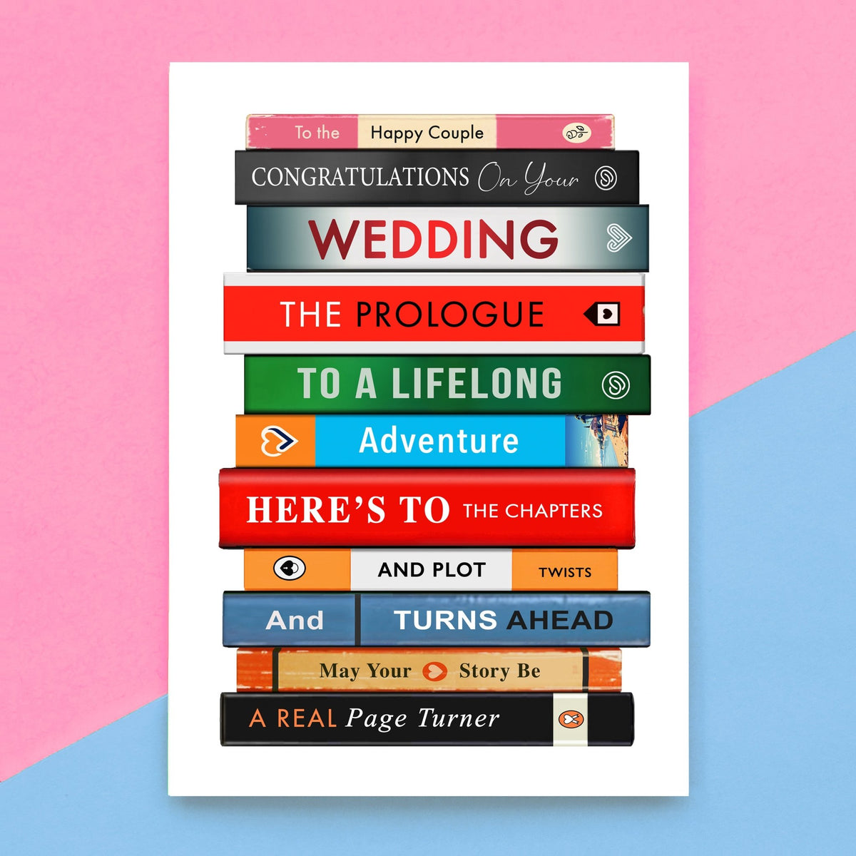 book stack wedding card on a pink and blue background
