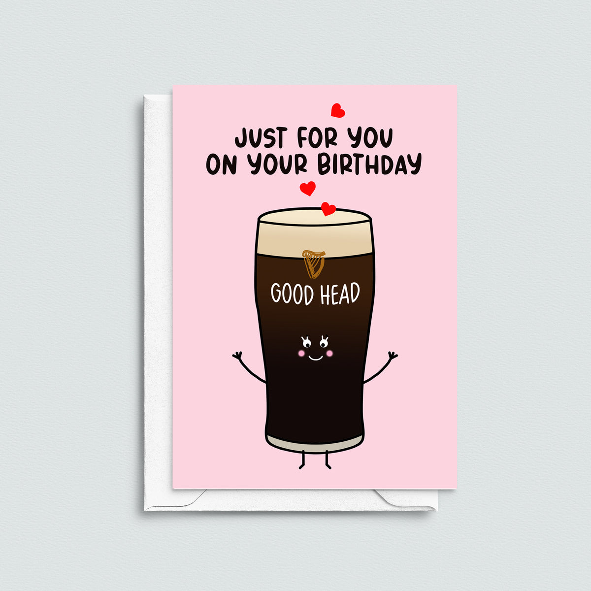 Birthday card with a cartoon pint of guinness and text on a pink background