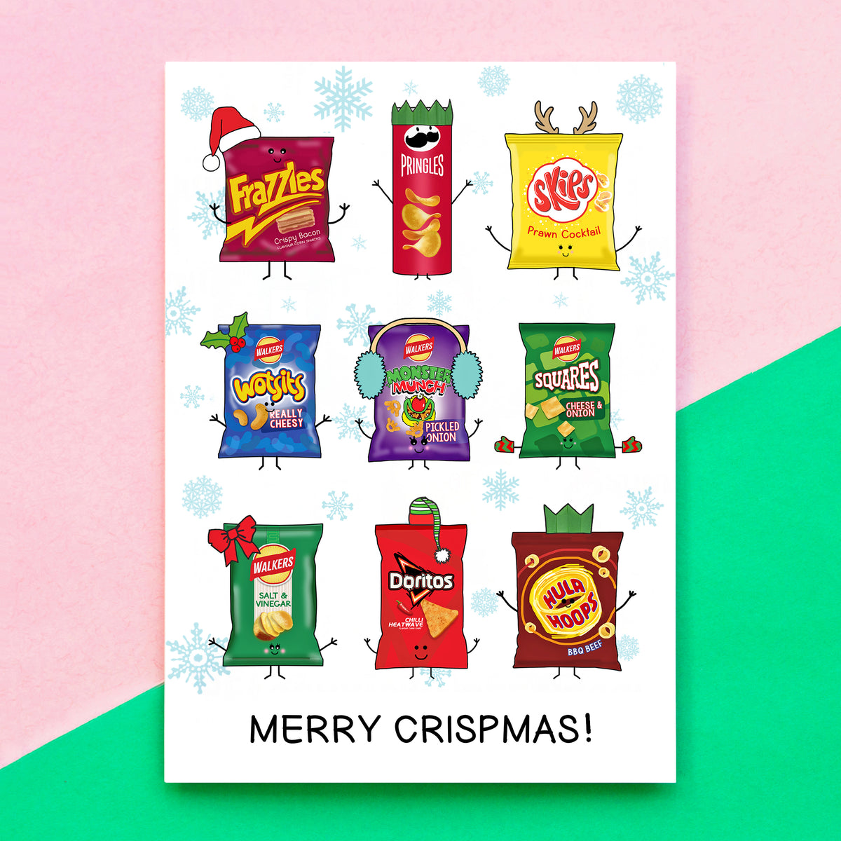 A festive Christmas card featuring nine cartoon crisp packets with 'MERRY CRISPMSMAS!' printed at the bottom. The card is displayed against a diagonally split pink and green background.