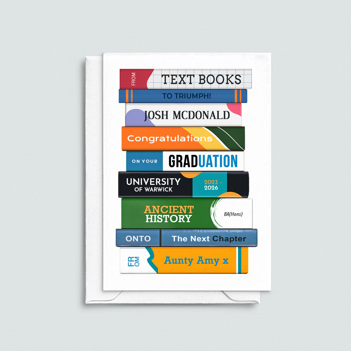 Graduation card with colorful text books design on a light gray background