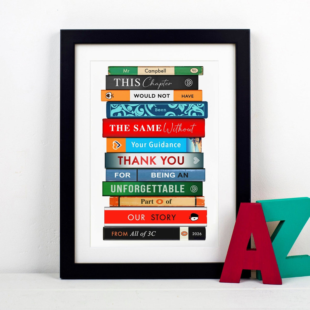 Framed artwork of colourful bookstack with text thanking a teacher on a white background