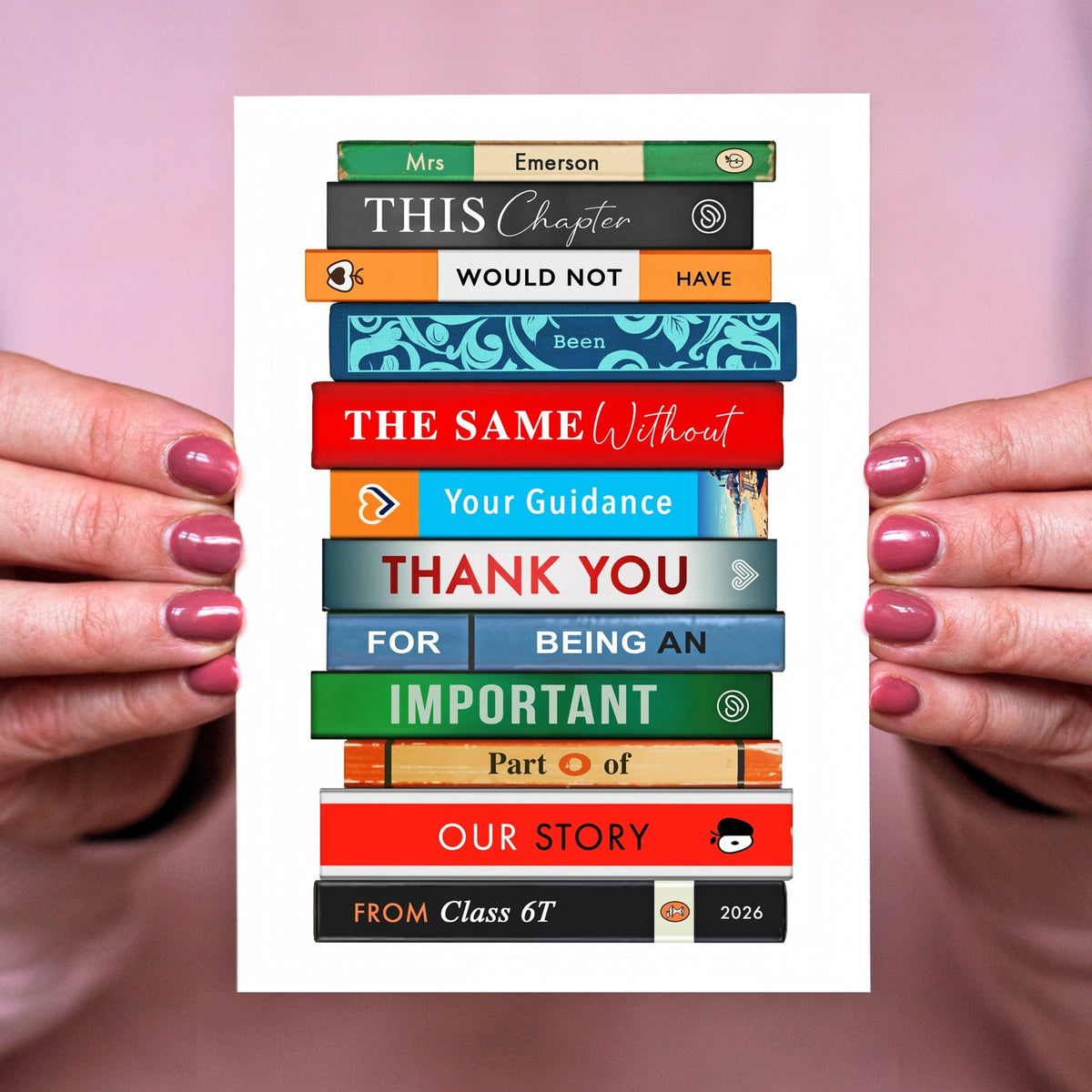Person holding a thank you teacher card with a stack of colorful books design and text.