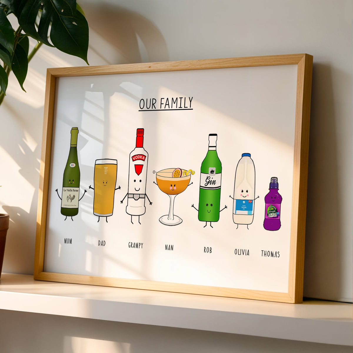 a custom family portrait made up of each family members favourite drink. Pictured in an oak frame on a shelf