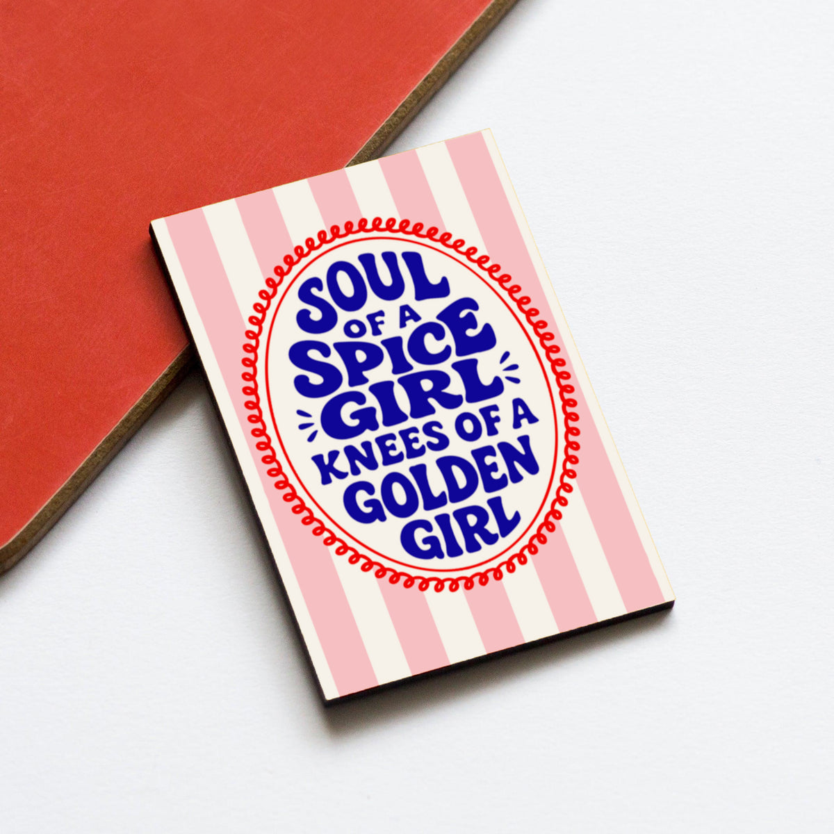 Fridge magnet with 'Soul of a Spice Girl, Knees of a Golden Girl' text on a red and white striped background