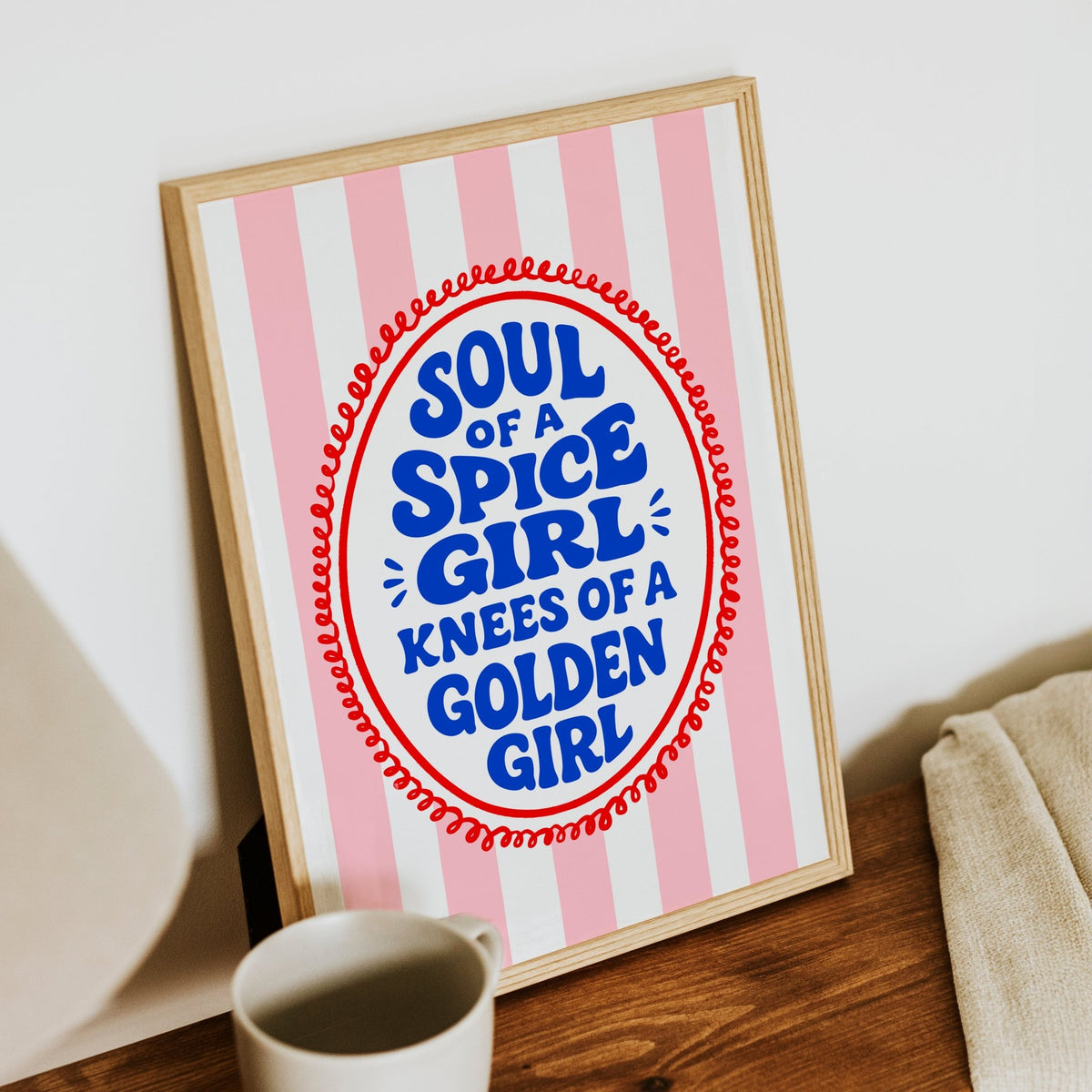 soul of a spice girl slogan print in wooden frame on shelf with mug