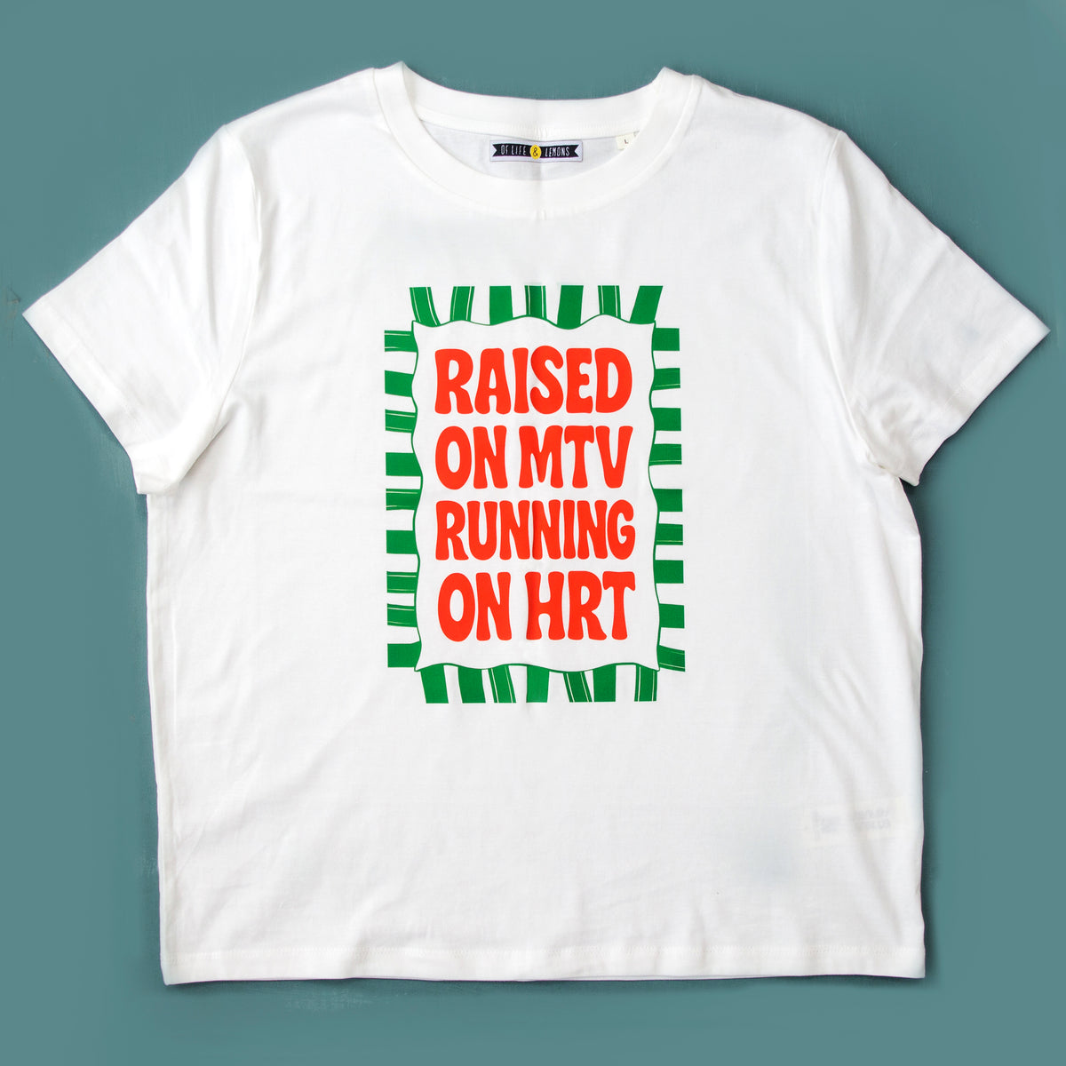 white tshirt saying raised on mtv running on hrt on a blue background