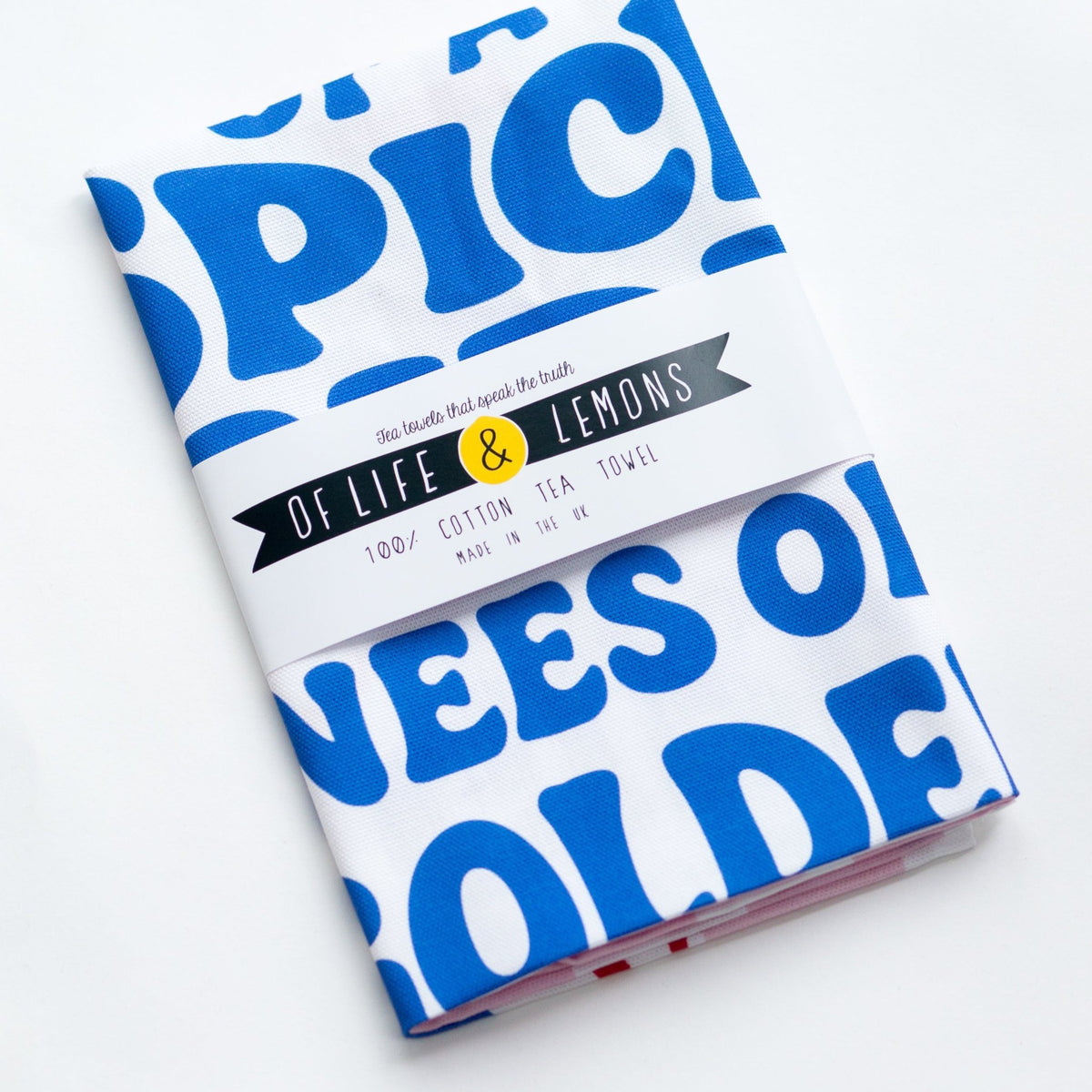 soul of a spice girl tea towel in of life and lemons packaging on a white background