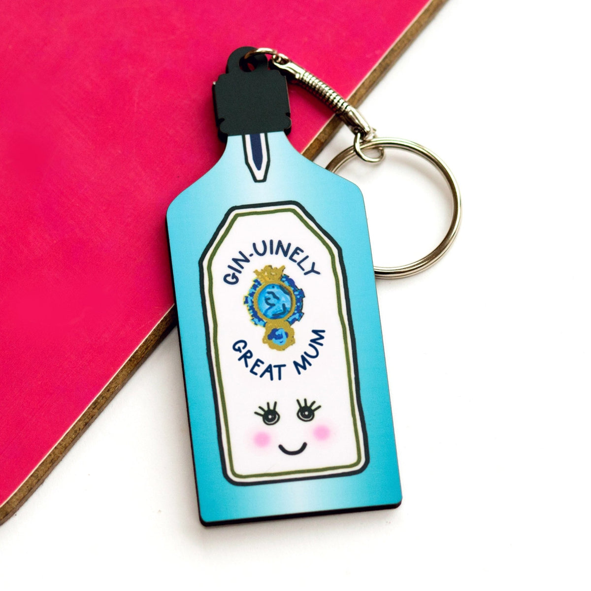Keychain shaped like a bottle with 'Gin-uitinely Great Mum' text on a pink and white background