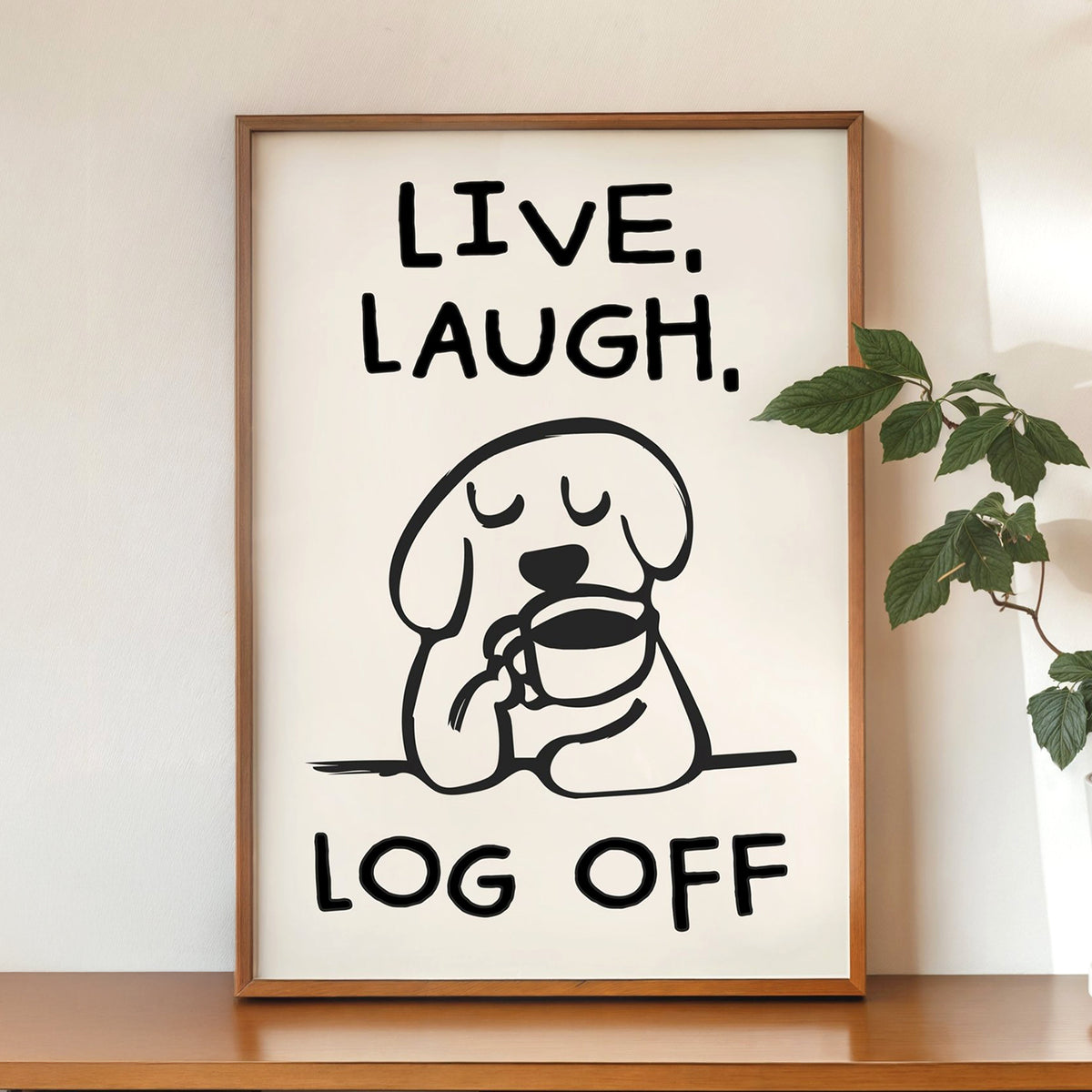 Framed poster with a dog holding a coffee cup and text 'Live. Laugh. Log Off' on a white background.
