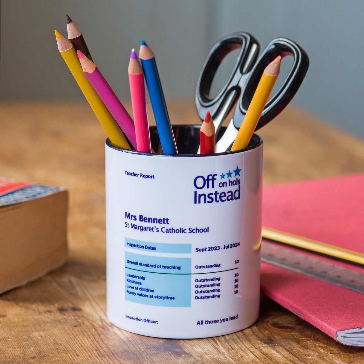 a pen pot for teachers printed with a personalised ofsted style report
