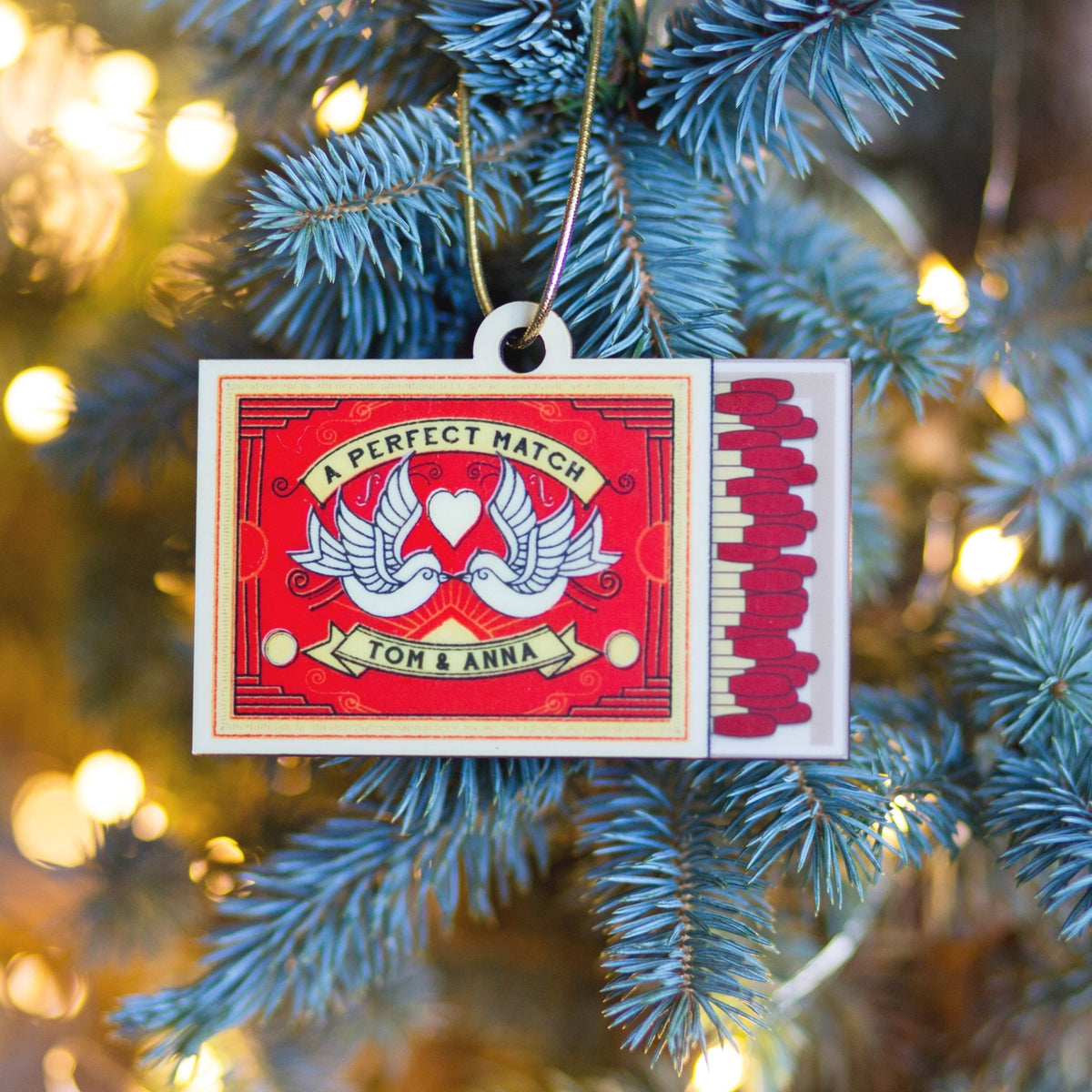 Decorative ornament with matches on a Christmas tree