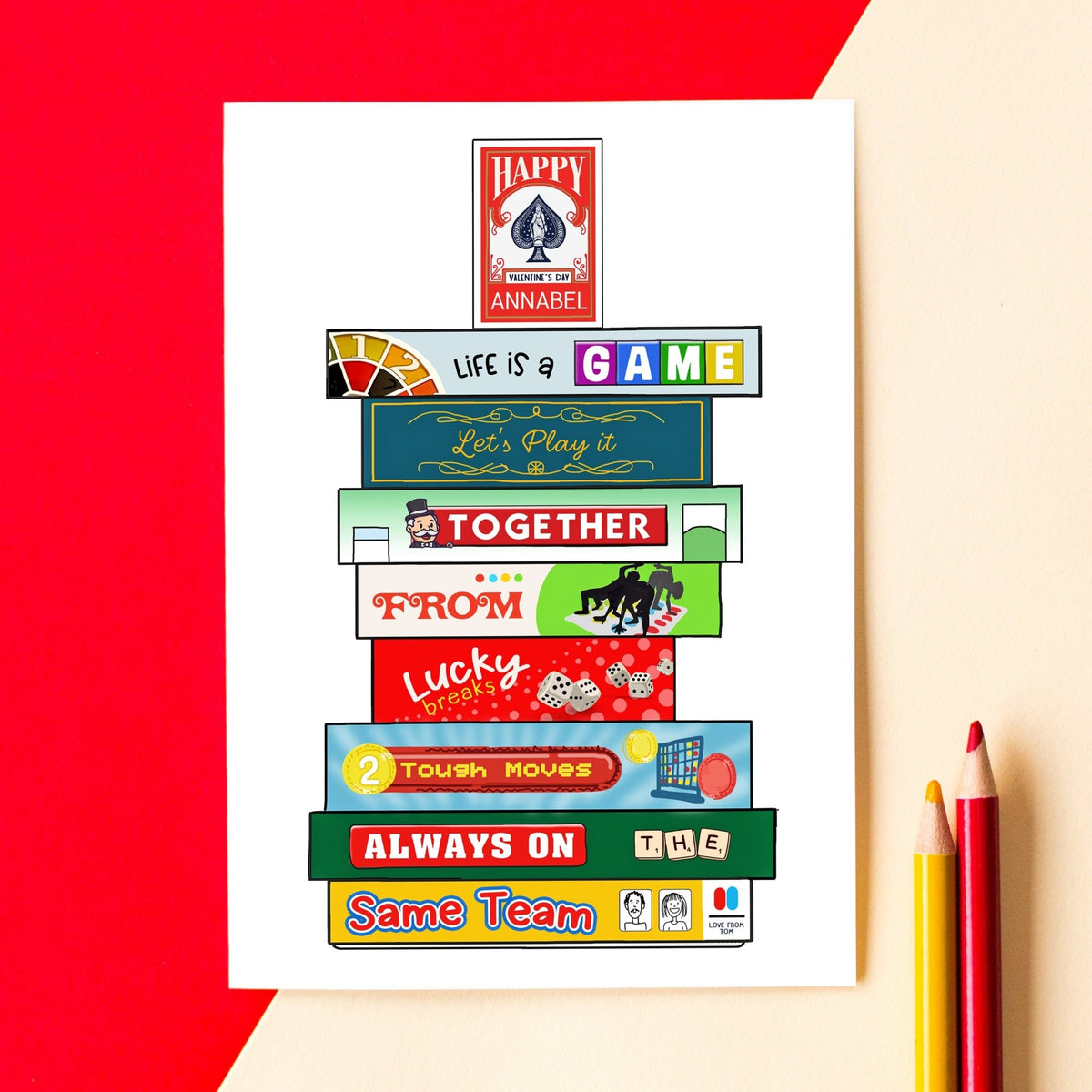 Stack of colourful board games on a red and beige background with two pencils.