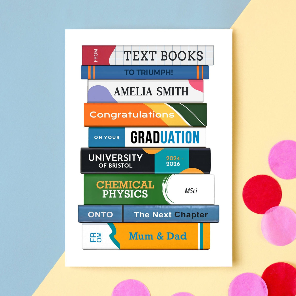 Graduation card with colorful text books design on a light blue and yellow background