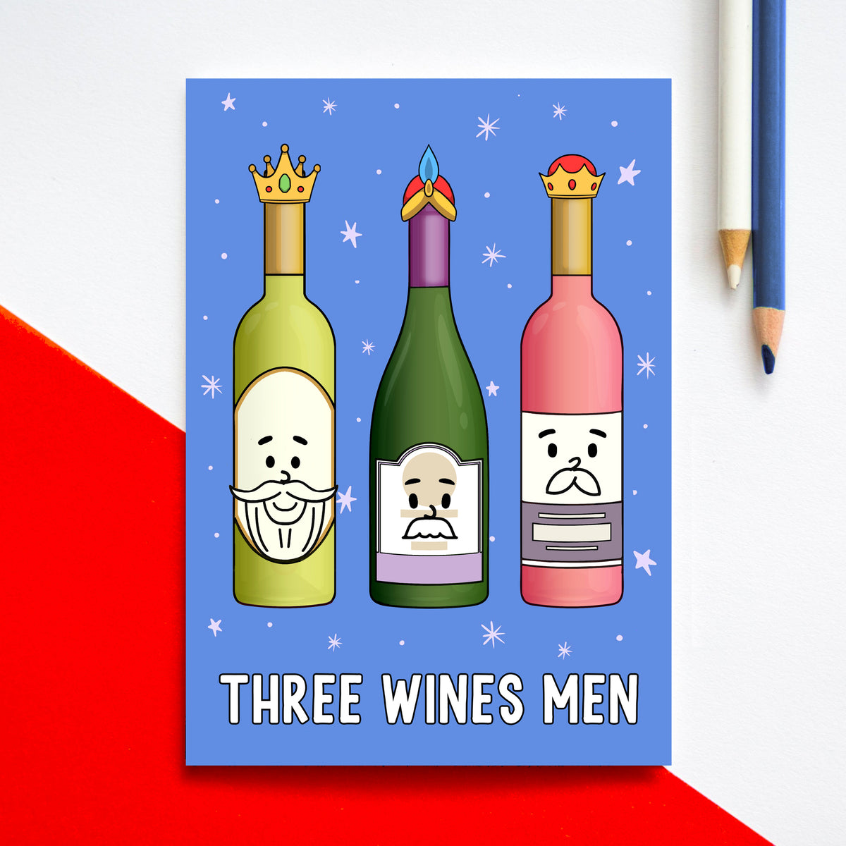 A funny christmas card featuring cartoon wine bottles with faces on a blue background, labeled 'Three Wines Men'.