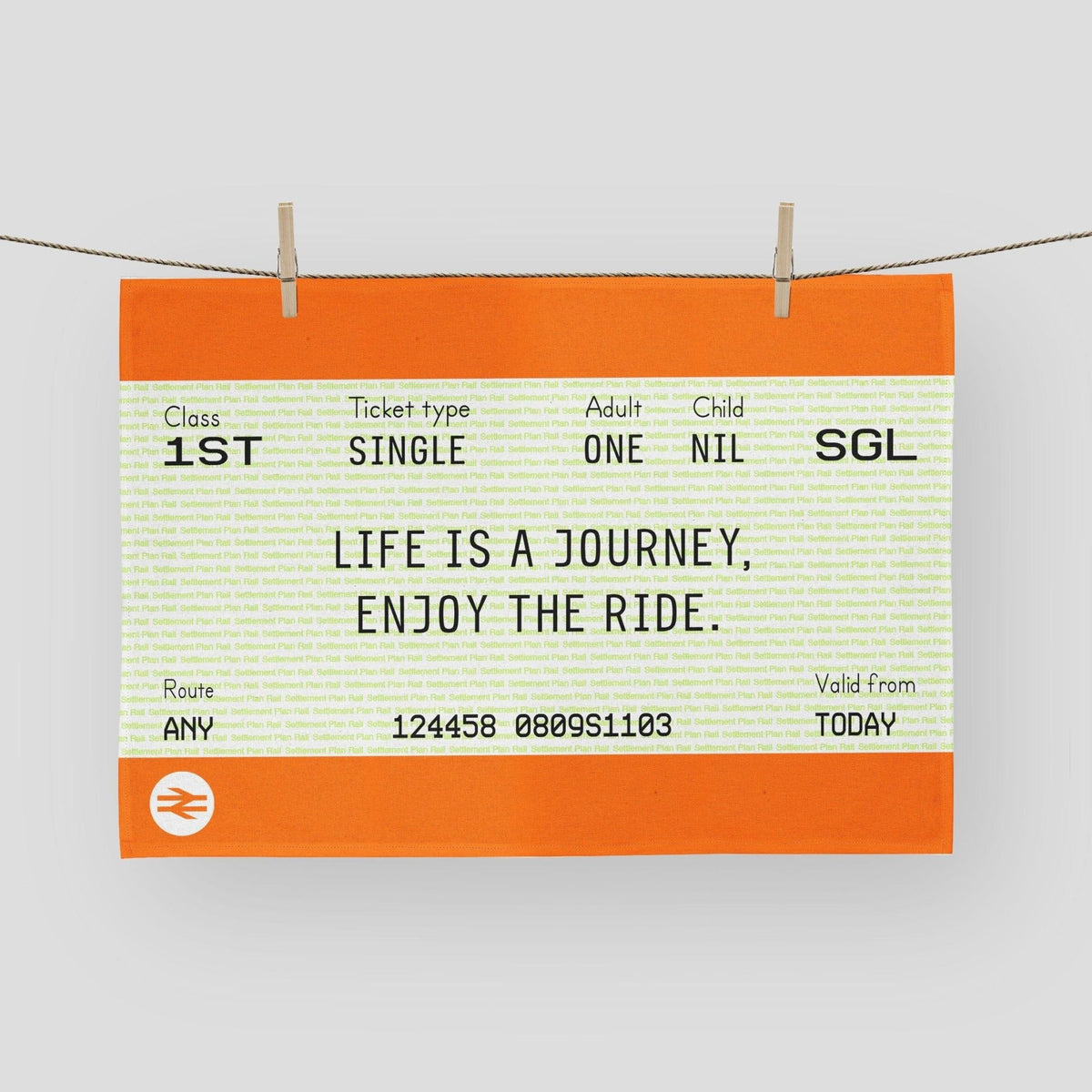 Train ticket-style tea towel with motivational quote 'Life is a journey, enjoy the ride.' on an orange background.